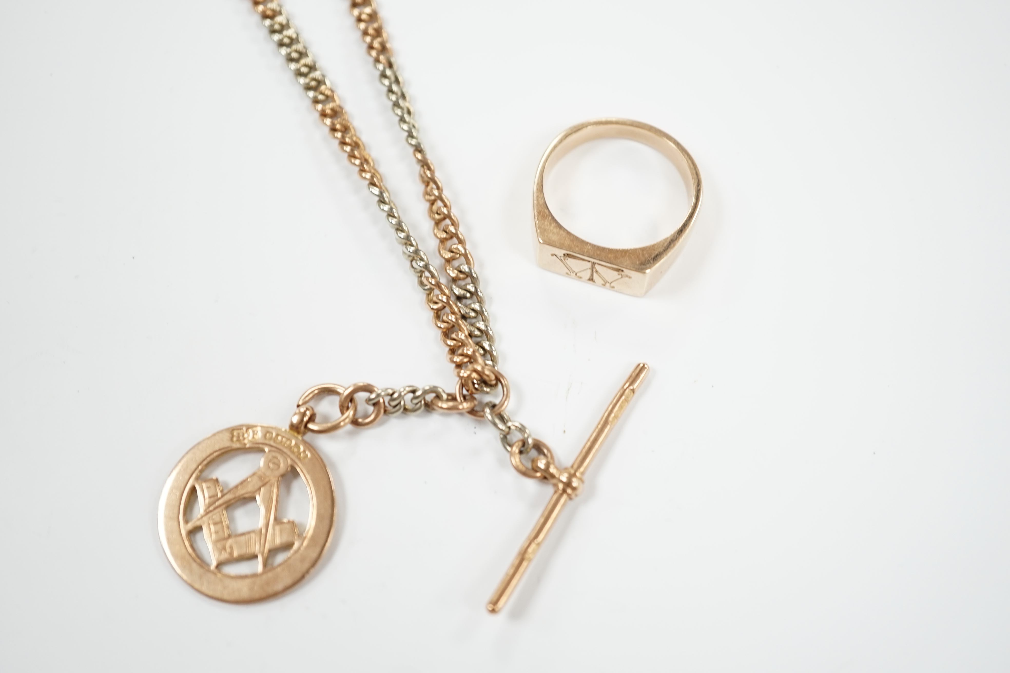 A two colour 9ct gold albert, 40cm, hung with a 9ct gold masonic medal, together with a 9ct masonic ring, gross weight 36.9 grams.
